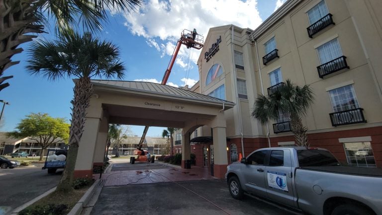 Commercial pressure washing at a Charleston-area hotel entrance
